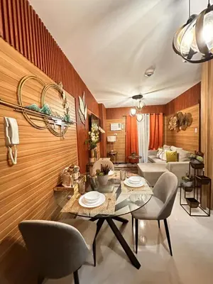 a dining room with a table and chairs at Modern 1BR Condo in Pasay With Balcony City View Free Swimming Pool Near NAIA Airport, PICC, CCP, MOA in Manila