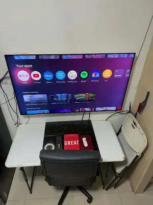 a desk with a computer on top of it at Light Residences by SMDC Boni MRT EDSA in Manila