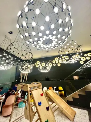 a room with a play equipment and a chandelier at Hotel Residences at Acqua in Manila