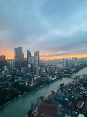 a view of a city with a river and buildings at Hotel Residences at Acqua in Manila