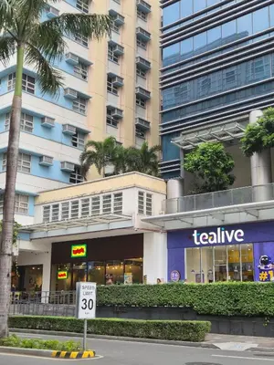 a building with a realize sign in front of it at Jacob's Place Near Manila Airport in Manila