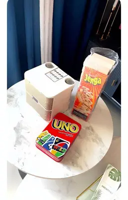 a table with a nintendo wii and a box on it at NAIA Terminal 3 Kaydren Airport Suite I Walk to Casino & Mall l 9-mins to Naia l Modern Stay 1 Bedroom in Manila