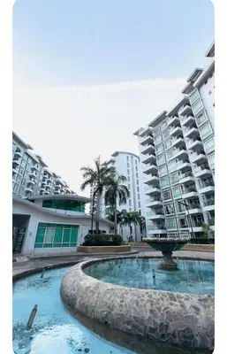 a fountain in front of two large buildings at NAIA Terminal 3 Kaydren Airport Suite I Walk to Casino & Mall l 9-mins to Naia l Modern Stay 1 Bedroom in Manila