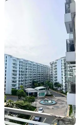 a view of a large apartment building with a parking lot at NAIA Terminal 3 Kaydren Airport Suite I Walk to Casino & Mall l 9-mins to Naia l Modern Stay 1 Bedroom in Manila