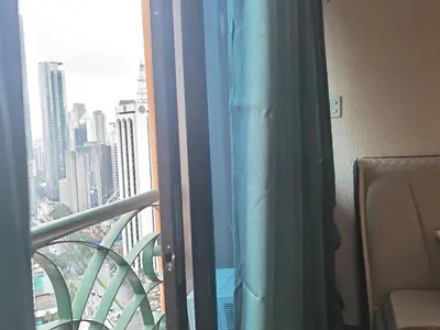 a room with a window with a view of a city at mooring in Manila