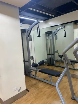 a gym with tread machines in a room at Venice Luxury Residences Emanuele in Manila