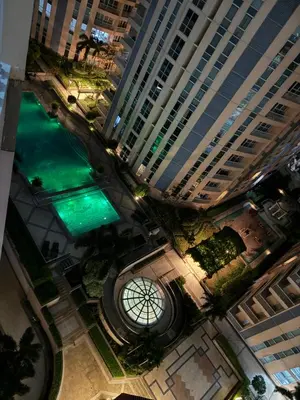 an overhead view of a large building with a green water at Venice Luxury Residences Emanuele in Manila