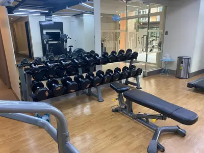 a gym with a rack of weights at Venice Luxury Residences Emanuele in Manila