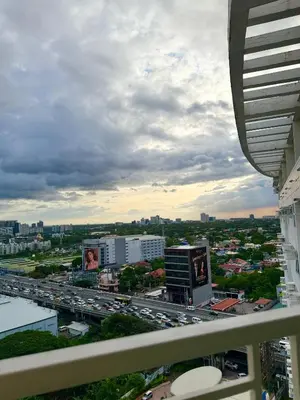 a view of a city with traffic on a highway at The Global Nest at Anuva Modern 1BR with Pool in Manila