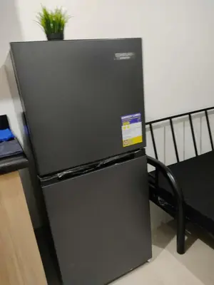 a black refrigerator with a sticker on it at Shore 2 Residences Tower 1 JayDa in Manila