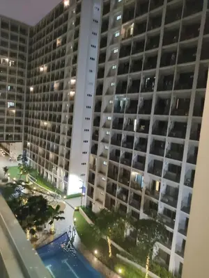 a view of a large building at night at Shore 2 Residences Tower 1 JayDa in Manila