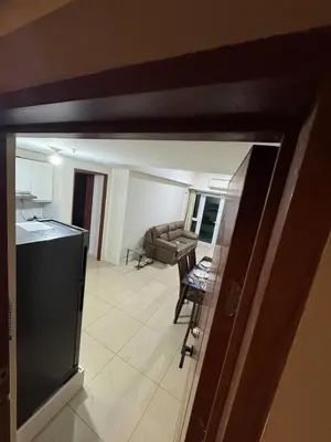 a view of a kitchen and a living room at Next Abode 1BR at TheBeaconMakati in Manila