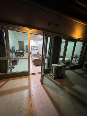 a living room with a tv on the floor at Next Abode 1BR at TheBeaconMakati in Manila