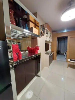 a kitchen with red stuffed animals on the counter at Condotel SM MOA sea residences in Manila