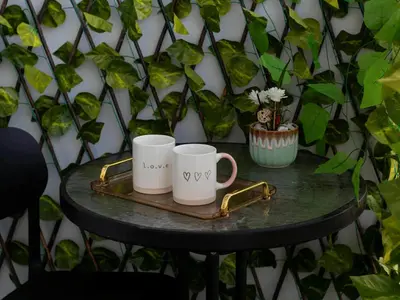 two coffee mugs on a tray on a table at 2 Bedroom Apartment Condotel Shore Residence Pasay in Manila