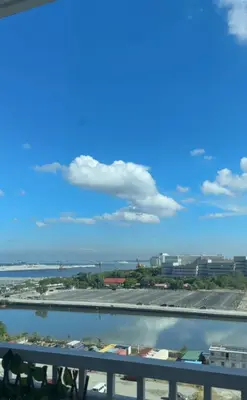 a view of a river from a bridge at 2 Bedroom Apartment Condotel Shore Residence Pasay in Manila