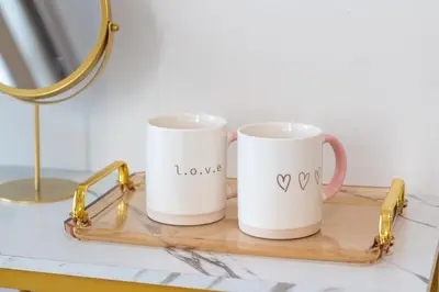 two mugs sitting on a tray on a table at 2 Bedroom Apartment Condotel Shore Residence Pasay in Manila