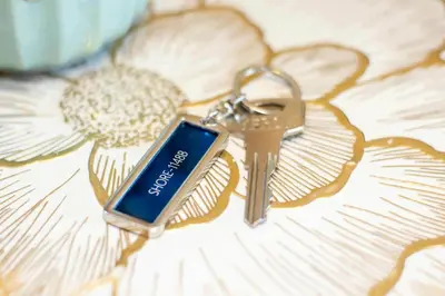 a pair of keys sitting on top of a flower at 2 Bedroom Apartment Condotel Shore Residence Pasay in Manila