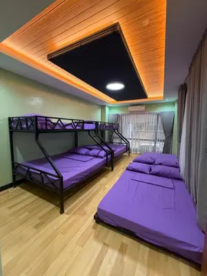 two bunk beds in a room with purple mattresses at Bella Tamara Private Resort in Binangonan