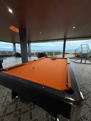 an orange pool table in a room with a view at Bella Tamara Private Resort in Binangonan
