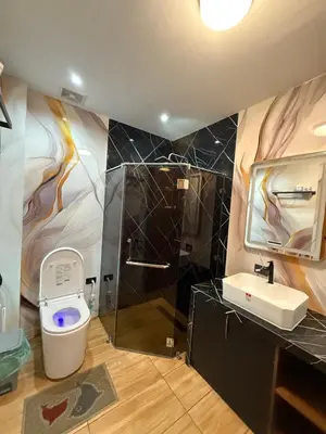 a bathroom with a toilet and a sink at Bella Tamara Private Resort in Binangonan