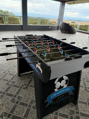 a foosball table with soccer balls on it at Bella Tamara Private Resort in Binangonan