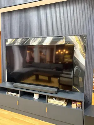 a large flat screen tv sitting on a entertainment center at Bella Tamara Private Resort in Binangonan