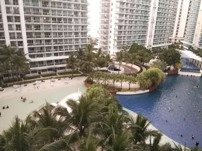 an aerial view of a resort with palm trees and buildings at OasisStaycation in Manila