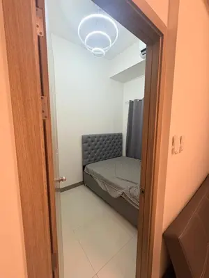 a small room with a bed and a door at Seva Condo Residences in Manila