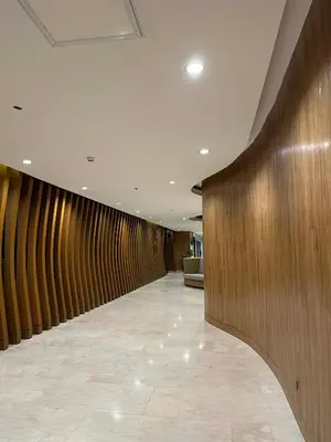 a long hallway with wooden walls in a lobby at ALFA staycation at Shore 2 tower 1 Pasay City in Manila