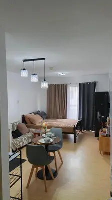 a living room with a couch and a table at Secret Nest in Manila