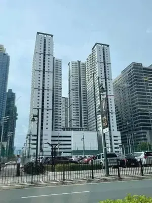 a group of tall buildings in a city at Vacation at Tolentino Residence in Manila