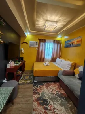 a small room with a bed and a couch at Escape to Nature Studio Unit in Puting Kahoy
