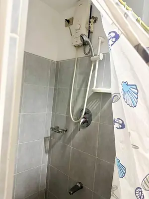 a shower in a bathroom with a shower curtain at Sea Residences Tower B Condotel Look F0R MaV in Manila