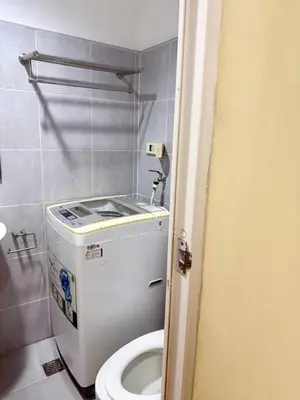 a small bathroom with a toilet and a sink at Sea Residences Tower B Condotel Look F0R MaV in Manila