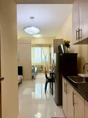 a kitchen with a refrigerator and a dining room at Sea Residences Tower B Condotel Look F0R MaV in Manila