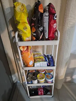 a refrigerator filled with lots of food at Casa Rosa2 2BR loft in BGC with 55 Smart TV 5 pax in Manila