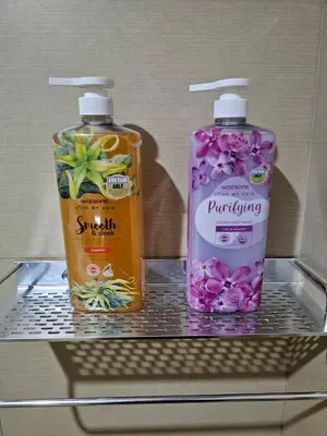 two bottles of cleaning products sitting on a shelf at Casa Rosa2 2BR loft in BGC with 55 Smart TV 5 pax in Manila