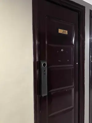 a black door with a sign on it at Yakal tanza garden height with Netflix in Tanza