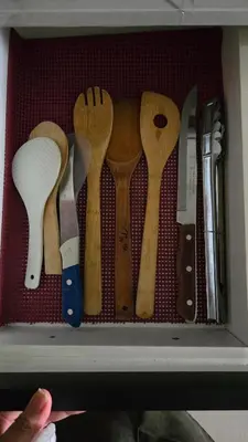 a drawer filled with lots of wooden utensils at 1BR Deluxe Suite pool view with Balcony in Manila