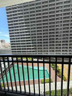 a view of a large building from a balcony at Fame Residences Staycation in Manila