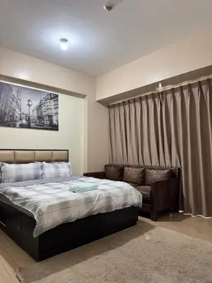 a bedroom with a bed and a couch at 81 Newport Across International Airport Terminal 3 C1-7O in Manila