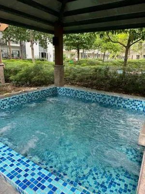 a swimming pool with blue tiles in a yard at 81 Newport Across International Airport Terminal 3 C1-7O in Manila