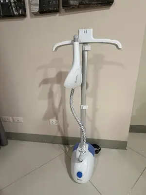 a white electric toothbrush holder in a bathroom at Condo in BGC by MichVist - Uptown Parksuites Tower 2 in Manila