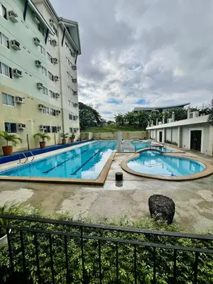 an image of a swimming pool in front of a building at Jin's Jaunt in Manila