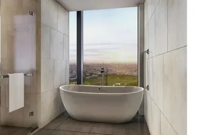 a bathroom with a tub and a large window at AC Hotel by Marriott Manila in Manila