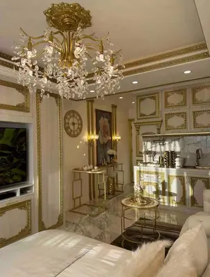 a living room with a bed and a chandelier at Royal Studio in Manila