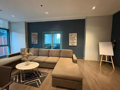 a living room with a couch and a table at Elegant BGC 1BR Staycation One Uptown Residence in Manila