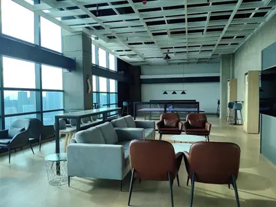 a living room with a couch and chairs and a table at Elements Residences 1br fully furnished with balcony in Manila