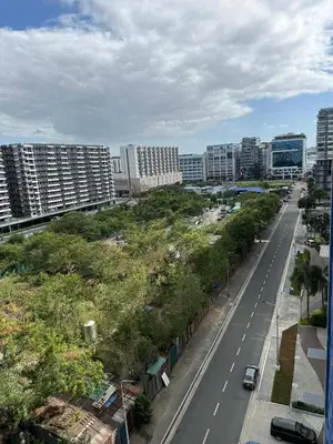 a view of a city street with tall buildings at Sea Residences Serenity in Manila